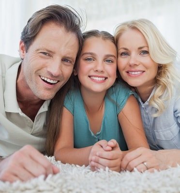 A happy family smiles to show how Orthodontics can enhance your smile	