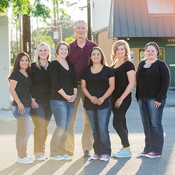 Dr. Zuroff, Orthodontist in Tri-Cities, and his amazing office staff stand outside their Kennewick, WA dental practice.